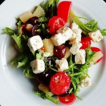Delicious Greek salad featuring fresh vegetables and creamy feta cheese, perfect for a healthy meal.